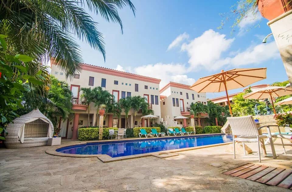 Resort buildings around a swimming pool at Las Sirenas by Mayan Princess Roatan Resort buildings around a swimming pool at Las Sirenas by Mayan Princess Roatan