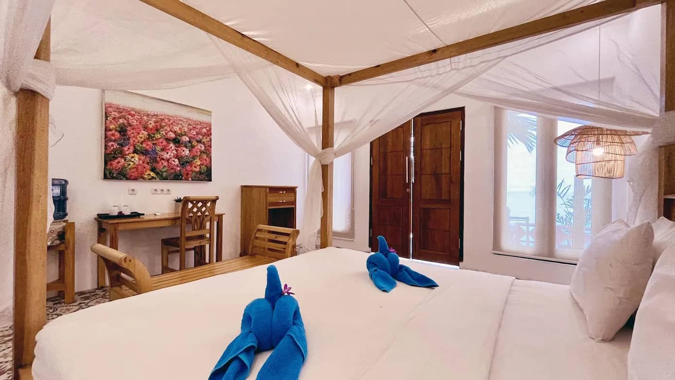 Large bed of the Deluxe Beachfront Room Large bed of the Deluxe Beachfront Room