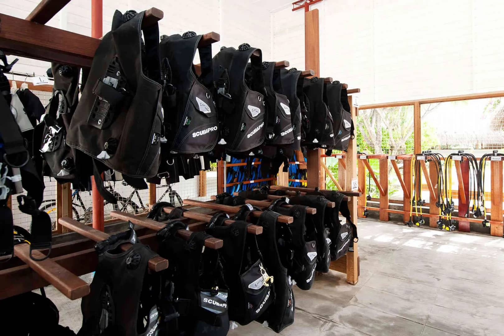 Scuba diving equipment hangs at Kuramathi Island Resort Maldives. Scuba diving equipment hangs at Kuramathi Island Resort Maldives.