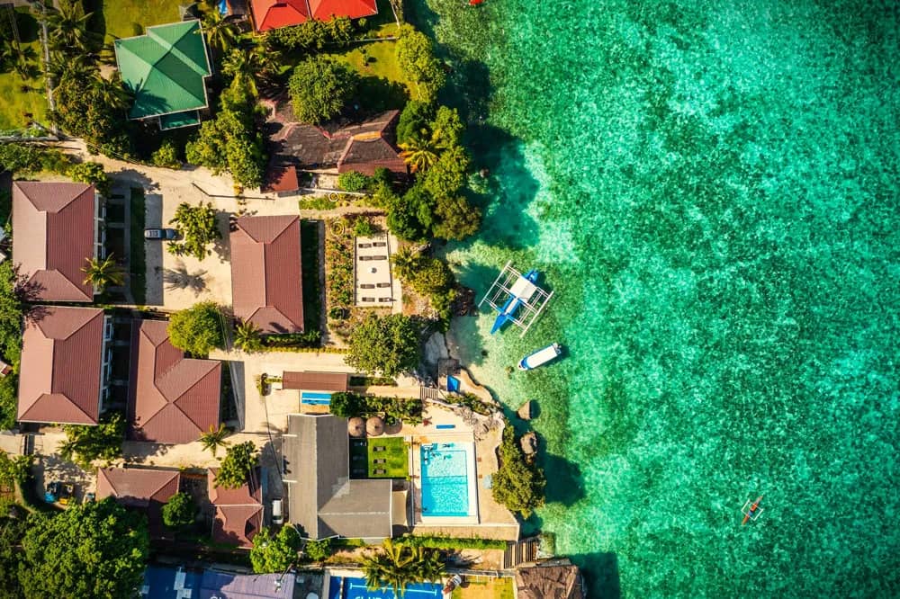 Cebu Seaview Dive Resort ariel view of ocean , pool, and resorts rooms Cebu Seaview Dive Resort ariel view of ocean , pool, and resorts rooms