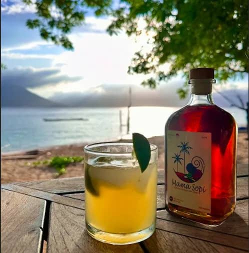 A cool alcoholic beverage set on the deck A cool alcoholic beverage set on the deck